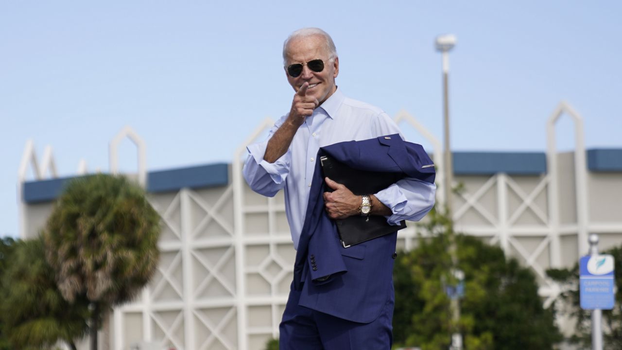 Democratic presidential candidate former Vice President Joe Biden jogs off stage after speaking at a drive-in rally at Broward College, Thursday, Oct. 29, 2020, in Coconut Creek, Fla. (AP Photo/Andrew Harnik)