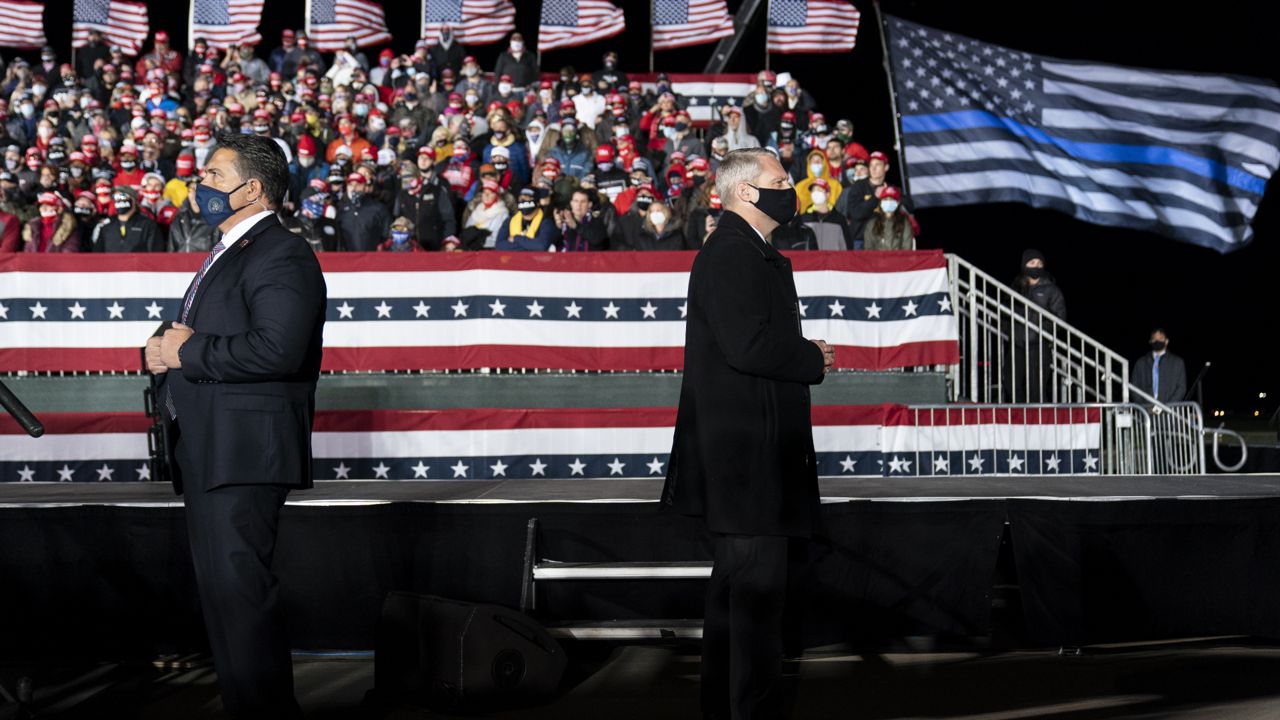 FILE: Secret Service agents watch the crowd as President Donald Trump addresses supporters during a campaign rally at the Ocala International Airport, Friday, Oct. 16, 2020, in Ocala, Fla. (AP Photo/Phelan M. Ebenhack)