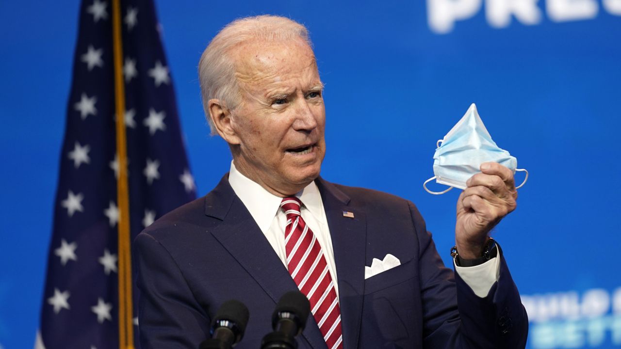 President-elect Joe Biden, accompanied by Vice President-elect Kamala Harris, speaks about economic recovery at The Queen theater, Monday, Nov. 16, 2020, in Wilmington, Del. (AP Photo/Andrew Harnik)