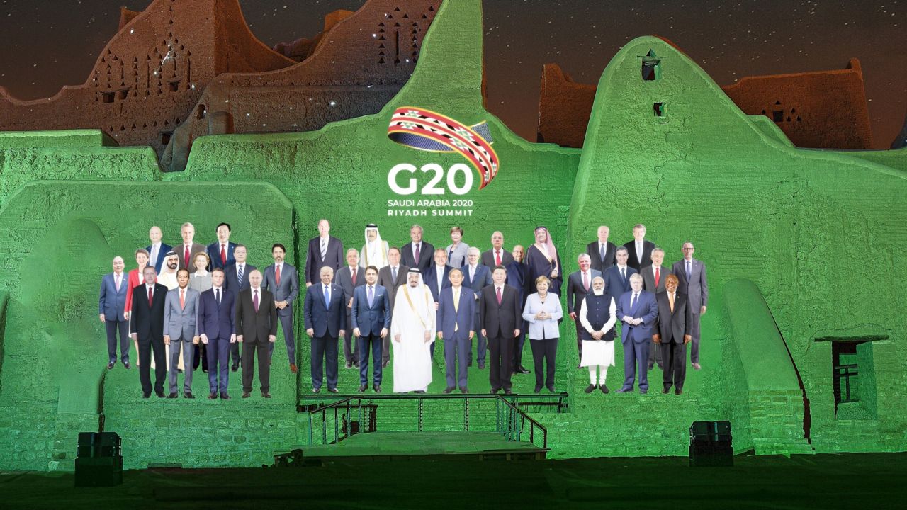 In this handout image provided by DGDA, Diriyah Gate Development Authority of Saudi, a family photo featuring members of the G20 is projected onto the walls of Salwa Palace, At Turaif on Saturday, Nov. 20, 2020 in Diriyah (Meshari-Alharbi, DGDA via AP)
