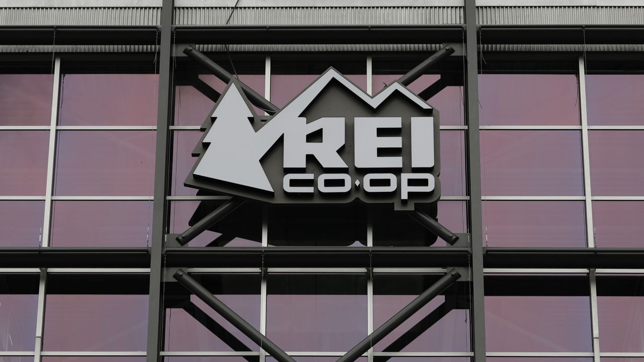 A sign at the REI flagship store is shown Friday, March 2, 2018, in Seattle