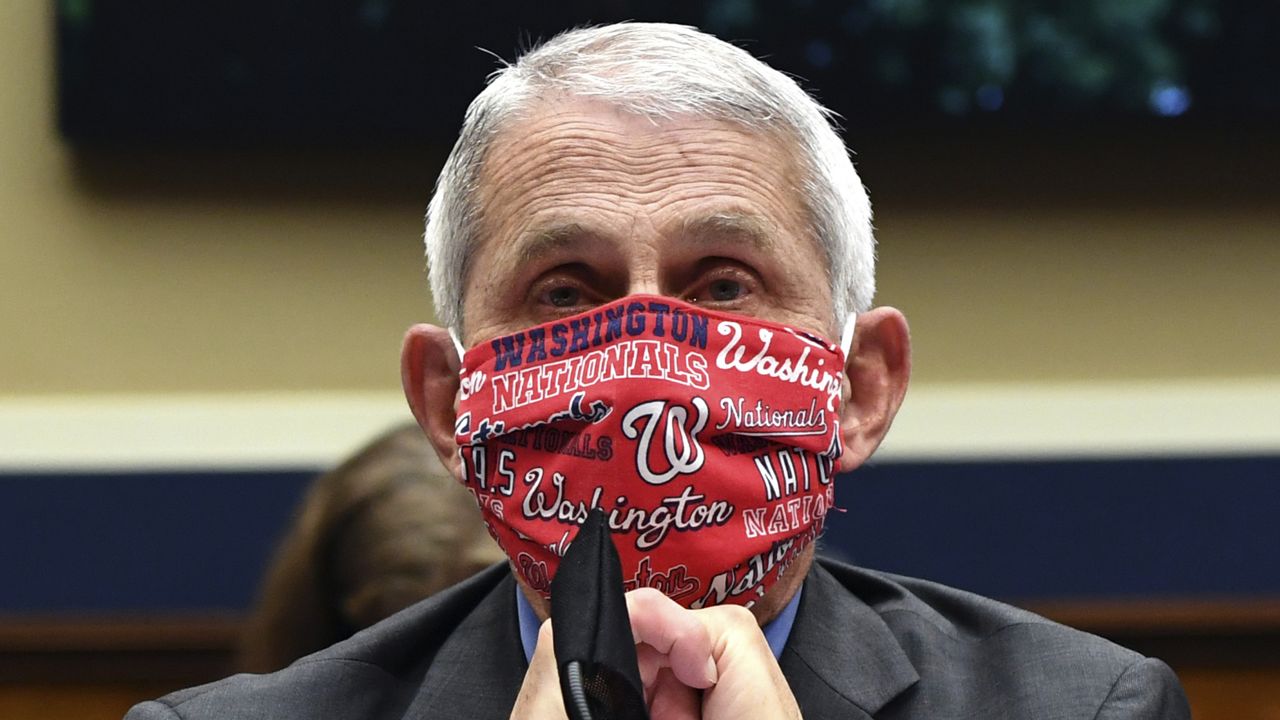 FILE- In this June 23, 2020 file photo, Director of the National Institute of Allergy and Infectious Diseases Dr. Anthony Fauci wears a face mask as he waits to testify before a House Committee on Energy and Commerce. (Kevin Dietsch/Pool via AP, File)