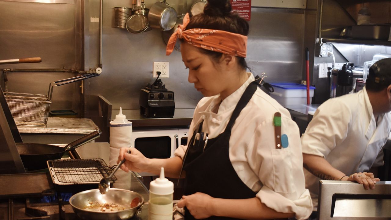 Chef Kyungmin "Kay" Hyun, of New York-based restaurant Mokyo, prepares food. (Courtesy Mokyo)