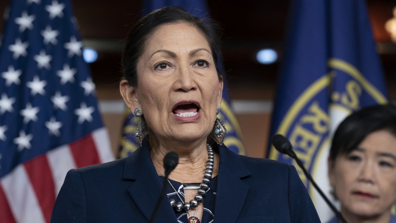 FILE - In this March 5, 2020, file photo Rep. Deb Haaland, D-N.M., Native American Caucus co-chair, joined at right by Rep. Judy Chu, D-Calif., chair of the Congressional Asian Pacific American Caucus, speaks to reporters about the 2020 Census on Capitol Hill in Washington. (AP Photo/J. Scott Applewhite, File)