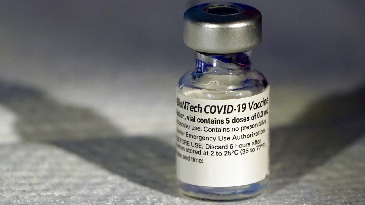 A vial of Pfizer's COVID-19 vaccine that receivedemergency use authorization is seen at George Washington University Hospital, Monday, Dec. 14, 2020, in Washington. (AP Photo/Jacquelyn Martin, Pool)