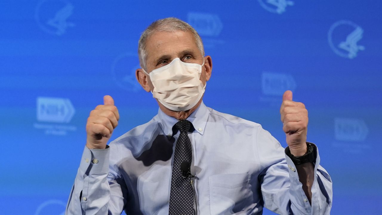 Dr. Anthony Fauci, director of the National Institute of Allergy and Infectious Diseases, gestures after receiving his first dose of the COVID-19 vaccine at the National Institutes of Health, Tuesday, Dec. 22, 2020, in Bethesda, Md. (AP Photo/Patrick Semansky, Pool)