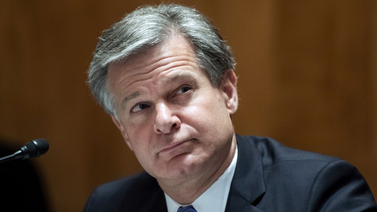 FILE - In this Sept. 24, 2020 file photo, FBI Director Christopher Wray, testifies during a Senate Homeland Security and Governmental Affairs Committee hearing on Capitol Hill in Washington. (Tom Williams/Pool via AP, File)