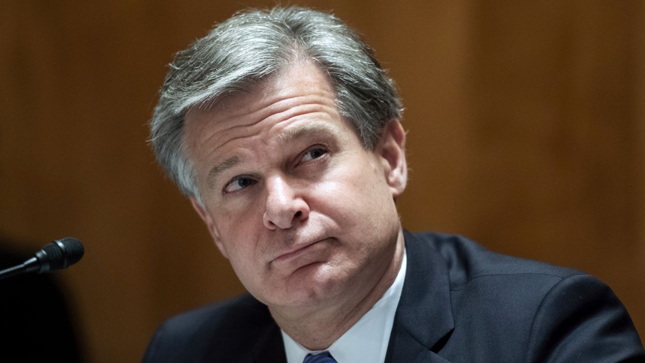 FILE - In this Sept. 24, 2020 file photo, FBI Director Christopher Wray, testifies during a Senate Homeland Security and Governmental Affairs Committee hearing on Capitol Hill in Washington. (Tom Williams/Pool via AP, File)