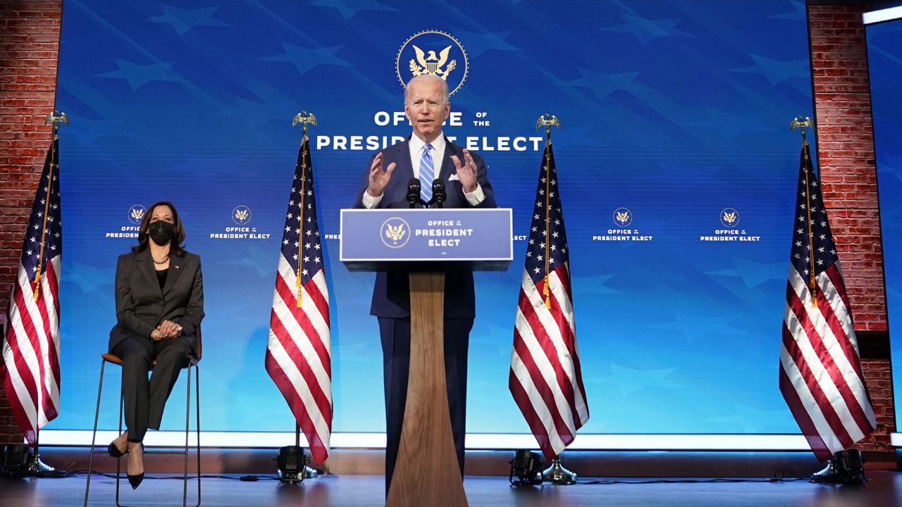 President-elect Joe Biden speaks about the COVID-19 pandemic during an event at The Queen theater, Thursday, Jan. 14, 2021, in Wilmington, Del., as Vice President-elect Kamala Harris listens. (AP Photo/Matt Slocum)