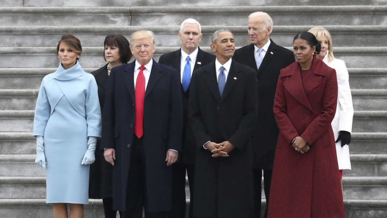 From left, first lady Melania Trump, Karen Pence, President Donald Trump, Vice President Mike Pence, former president Barack Obama, former vice president Joe Biden, Michelle Obama and Jill Biden stand on the steps of the U.S. Capitol on Friday, Jan. 20, 2017, in Washington, after Trump's inauguration ceremony. (Rob Carr/Pool Photo via AP)