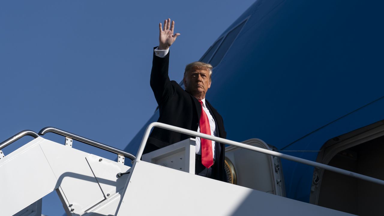 FILE: President Donald Trump waves as he walks to Air Force One upon departure, Tuesday, Jan. 12, 2021, at Andrews Air Force Base, Md. (AP Photo/Alex Brandon)