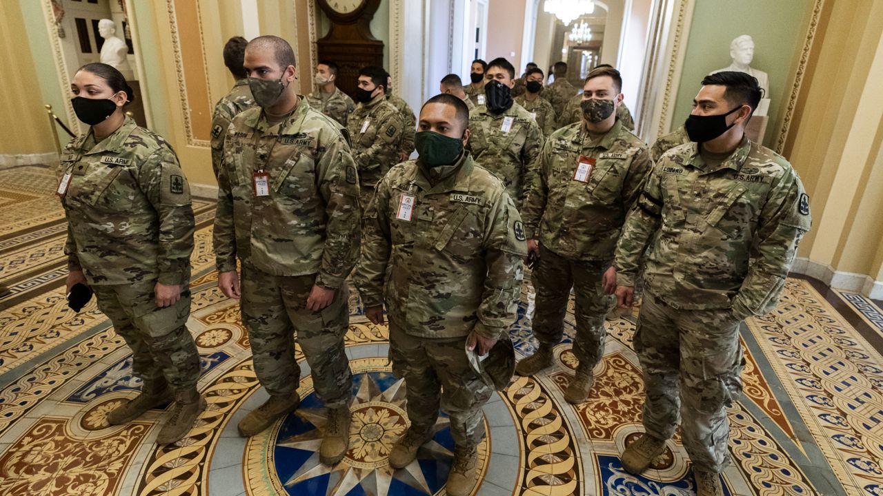 Members of the Hawaii Army National Guard on duty at the U.S. Capitol stand outside the Senate Chamber. (AP Photo/Manuel Balce Ceneta)