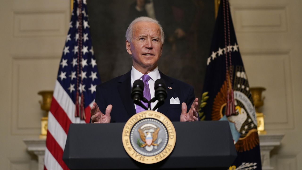 President Joe Biden delivers remarks on COVID-19, in the State Dining Room of the White House, Tuesday, Jan. 26, 2021, in Washington. (AP Photo/Evan Vucci)