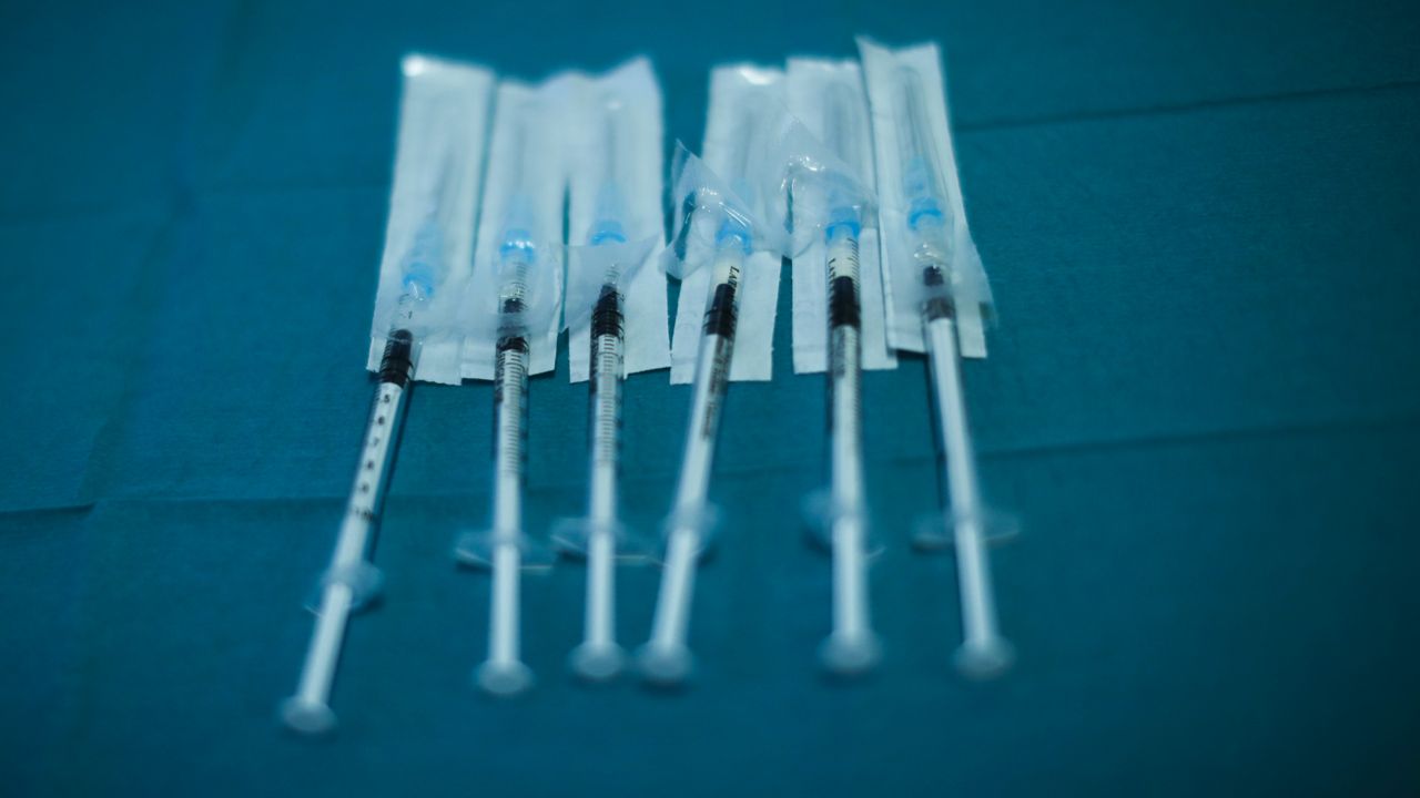 FILE: Syringes with Pfizer/Biontech COVID-19 vaccines are ready to be used at the MontLegia CHC hospital Wednesday, Jan. 27, 2021. (AP Photo/Francisco Seco)