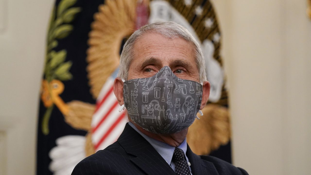 FILE: Dr. Anthony Fauci listens during an event with President Joe Biden on the coronavirus in the State Dinning Room of the White House, Thursday, Jan. 21, 2021, in Washington. (AP Photo/Alex Brandon)