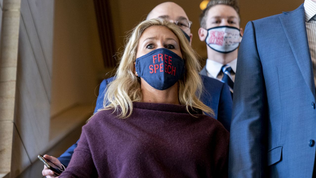 Rep. Marjorie Taylor Greene, R-Ga., goes back to her office after speaking on the floor of the House Chamber on Capitol Hill in Washington, Thursday, Feb. 4, 2021. (AP Photo/Andrew Harnik)