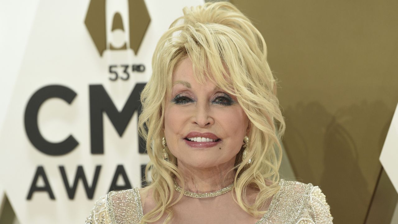 FILE: Dolly Parton arrives at the 53rd annual CMA Awards at Bridgestone Arena on Wednesday, Nov. 13, 2019, in Nashville, Tenn. (Photo by Evan Agostini/Invision/AP)