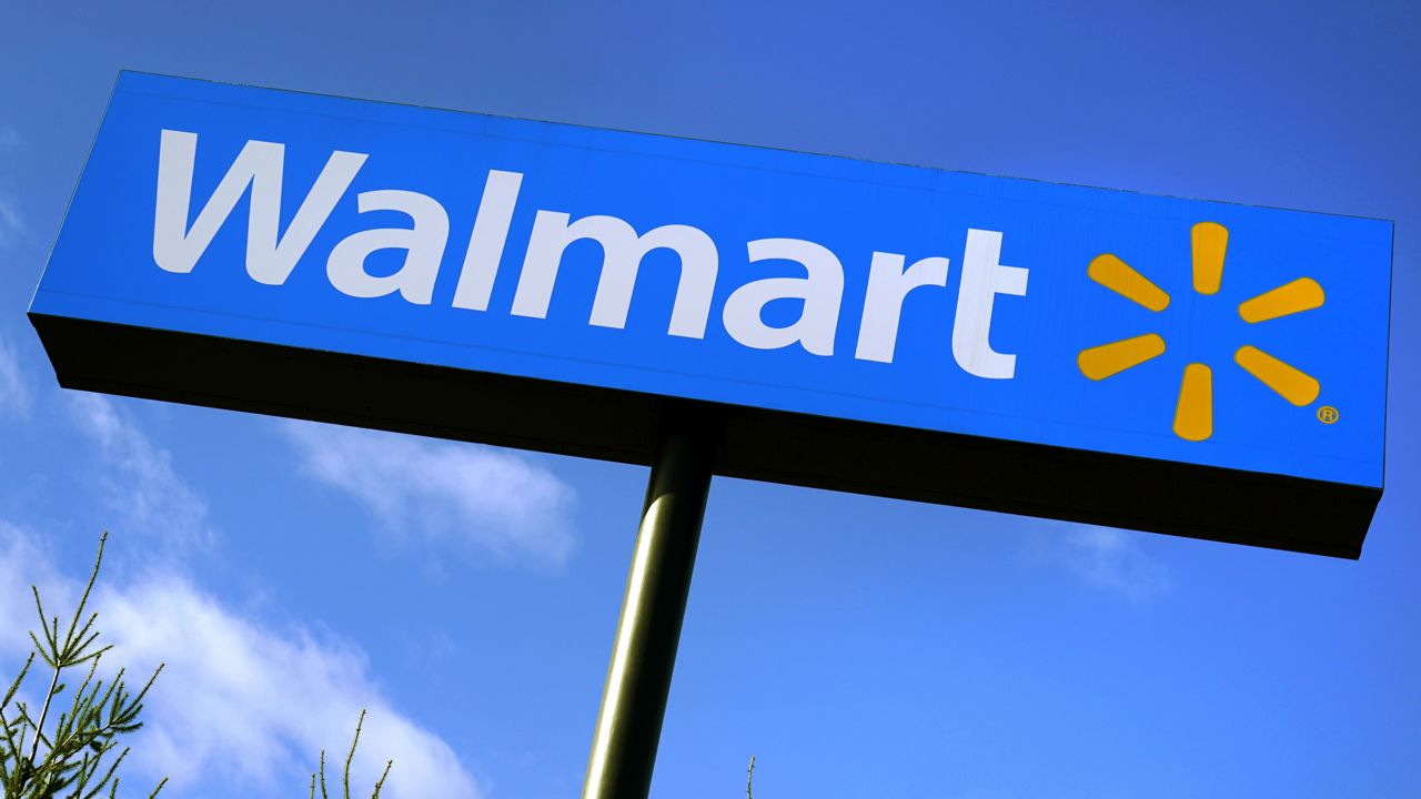 FILE - In this Nov. 18, 2020 file photo, a Walmart store sign is visible from Route 28 in Derry, N.H. (AP Photo/Charles Krupa, File)