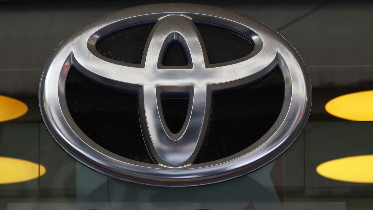 FILE - In this Sept. 20, 2017, file photo the Toyota logo is displayed at their shop on the Champs Elysees Avenue in Paris.  (AP Photo/Francois Mori, File)