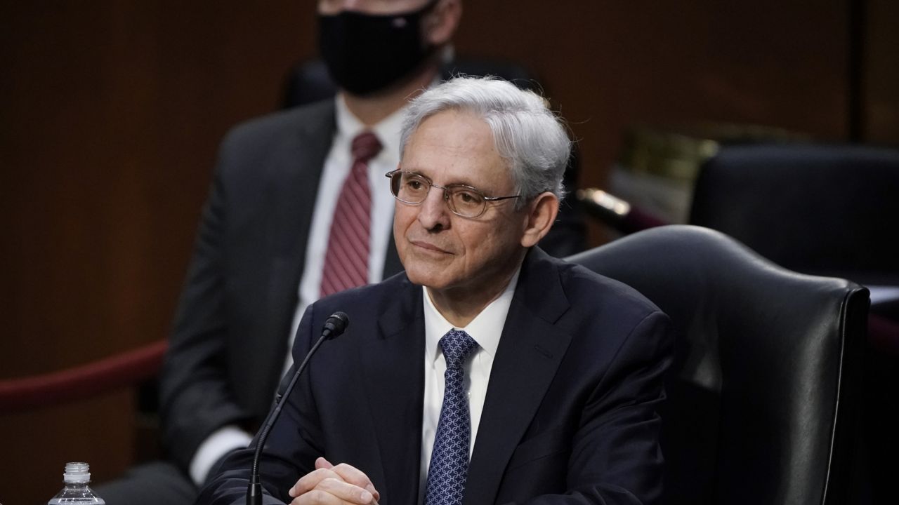 FILE: Judge Merrick Garland, President Joe Biden's pick to be attorney general, answers questions from Sen. Cory Booker, D-N.J., as he appears before the Senate Judiciary Committee. (AP Photo/J. Scott Applewhite)