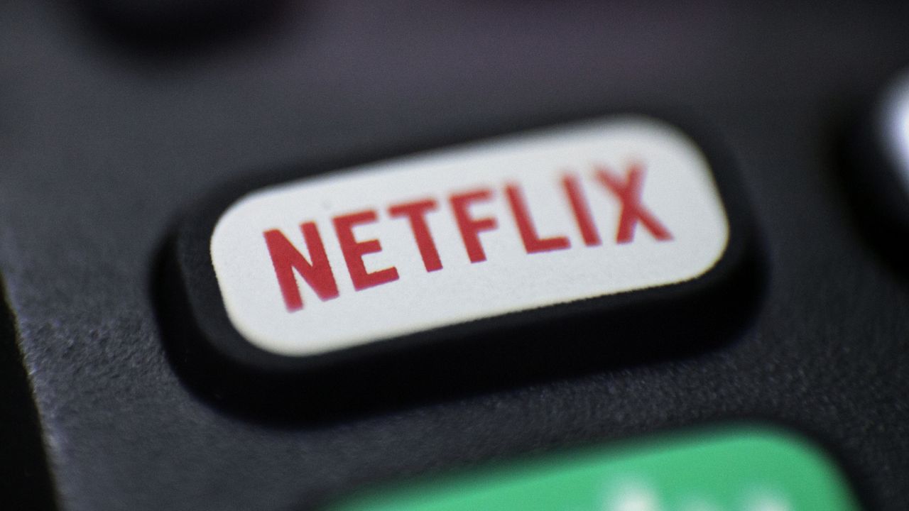 FILE - This Aug. 13, 2020, file photo shows a logo for Netflix on a remote control. (AP Photo/Jenny Kane, File)