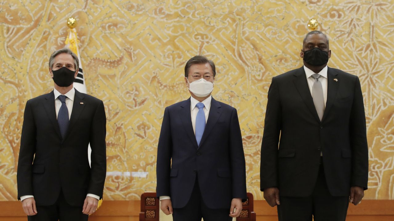 South Korean President Moon Jae-in, center, stands with U.S. Secretary of State Antony Blinken, left, and U.S. Defense Secretary Lloyd Austin as they pose for a photograph before their meeting at the presidential Blue House in Seoul, South Korea, Thursday, March 18, 2021. (AP Photo/Lee Jin-man, Pool)