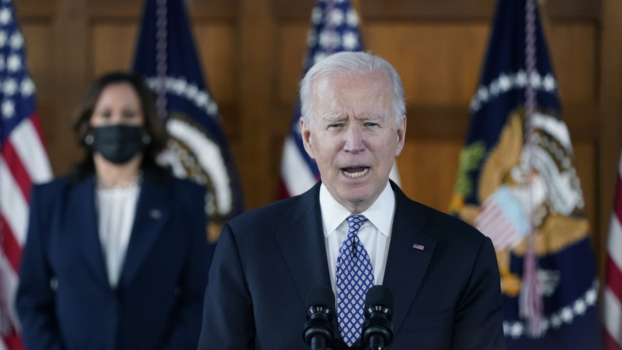 President Joe Biden speaks after meeting with leaders from Georgia's Asian-American and Pacific Islander community, Friday, March 19, 2021, at Emory University in Atlanta, as Vice President Kamala Harris listens. (AP Photo/Patrick Semansky)