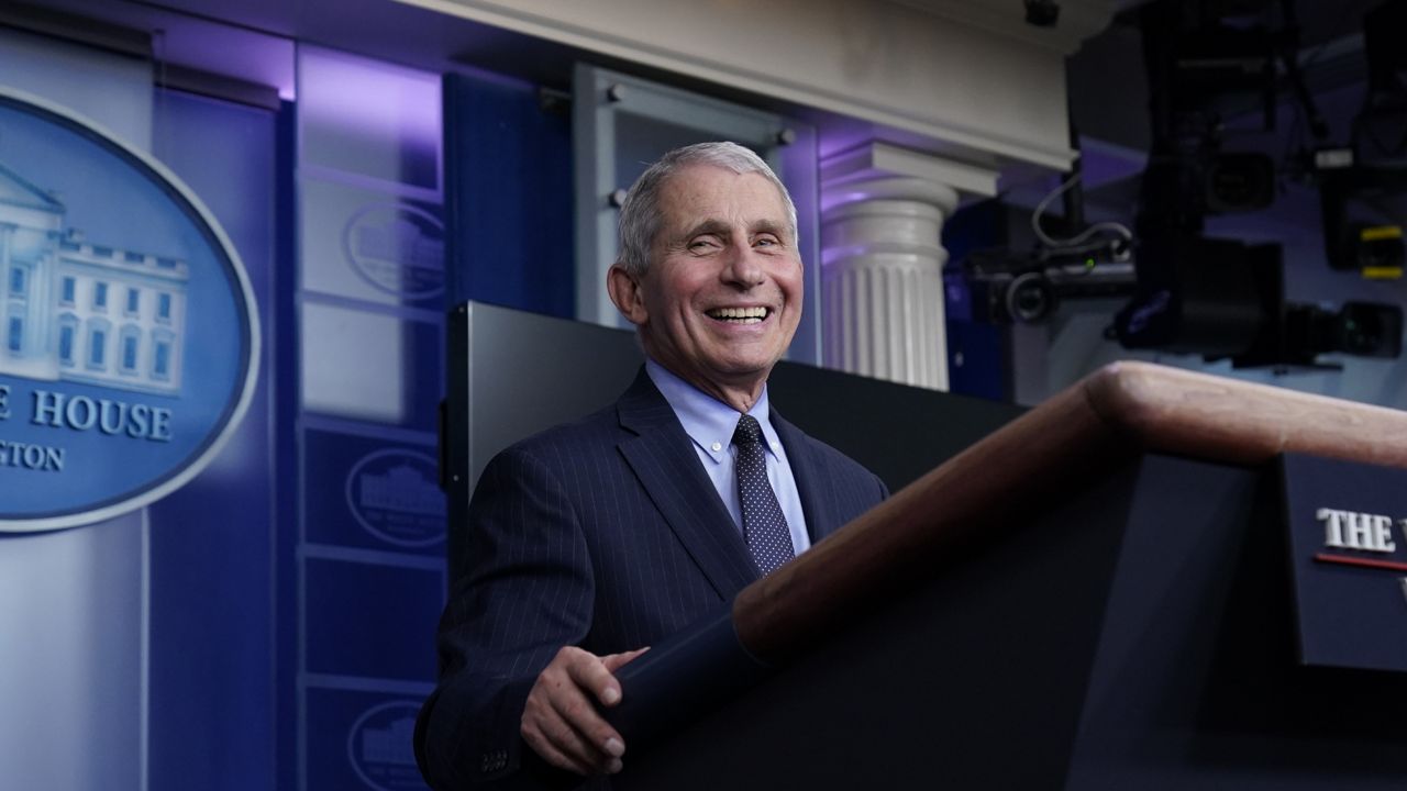 Dr. Anthony Fauci, director of the National Institute of Allergy and Infectious Diseases, laughs while speaking in the James Brady Press Briefing Room at the White House, Thursday, Jan. 21, 2021, in Washington. (AP Photo/Alex Brandon)