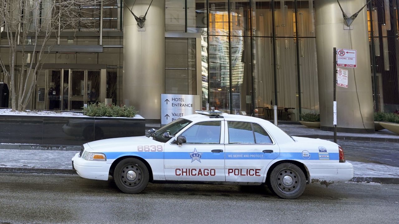 FILE: A Chicago police officer takes up a post Wednesday, Jan. 20, 2021. (AP Photo/Charles Rex Arbogast)