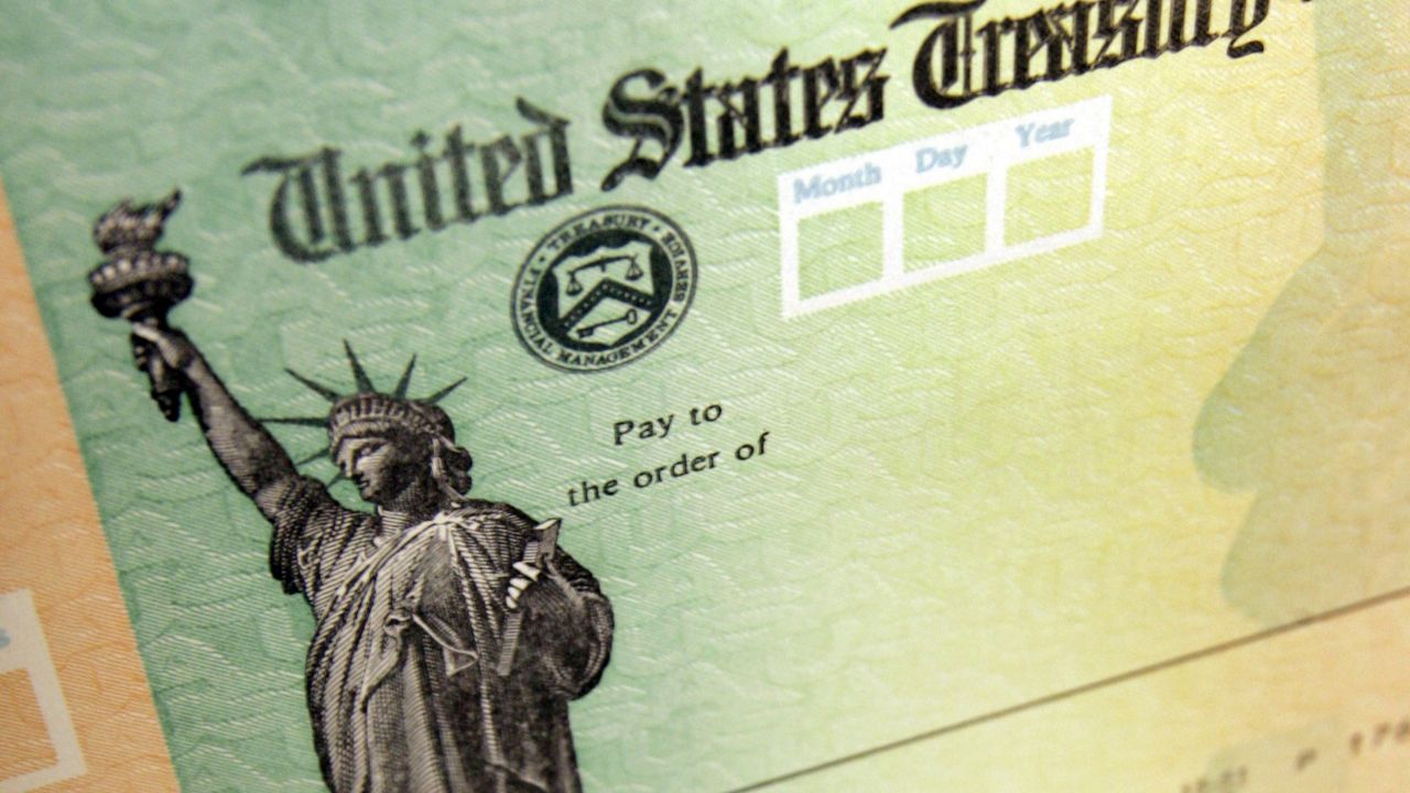 FILE - This May 8, 2008, file photo shows blank checks on an idle press at the Philadelphia Regional Financial Center. (AP Photo/Matt Rourke, File)