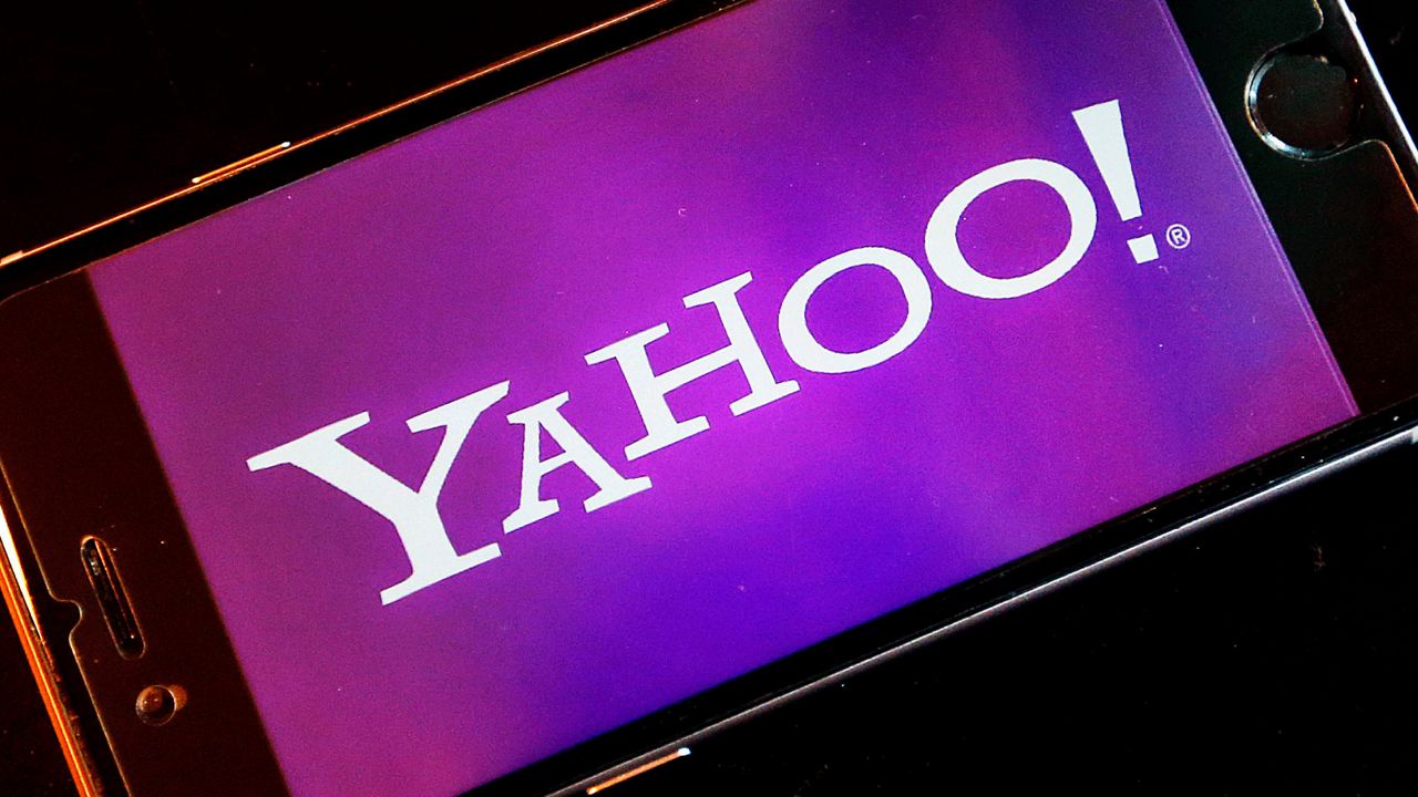FILE - In this Dec. 15, 2016, file photo, the Yahoo logo appears on a smartphone in Frankfurt. (AP Photo/Michael Probst, File)