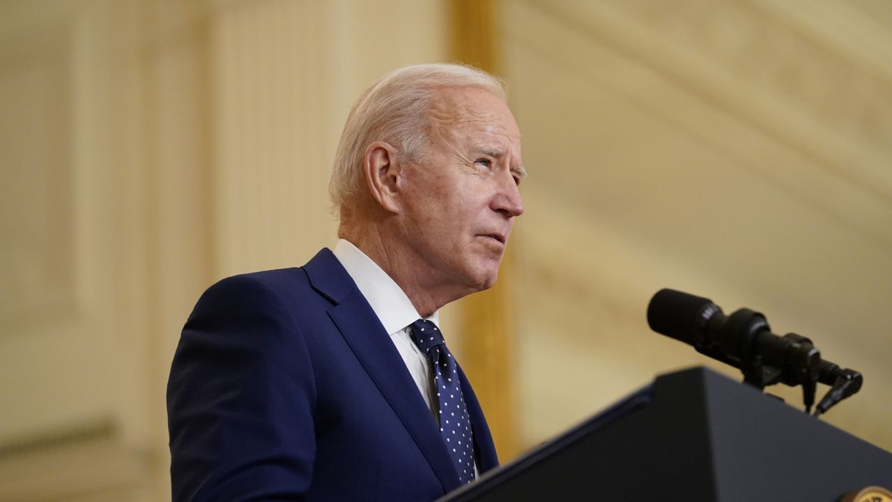 FILE: President Joe Biden speaks in the East Room of the White House, in Washington, Thursday, April 15, 2021. (AP Photo/Andrew Harnik)