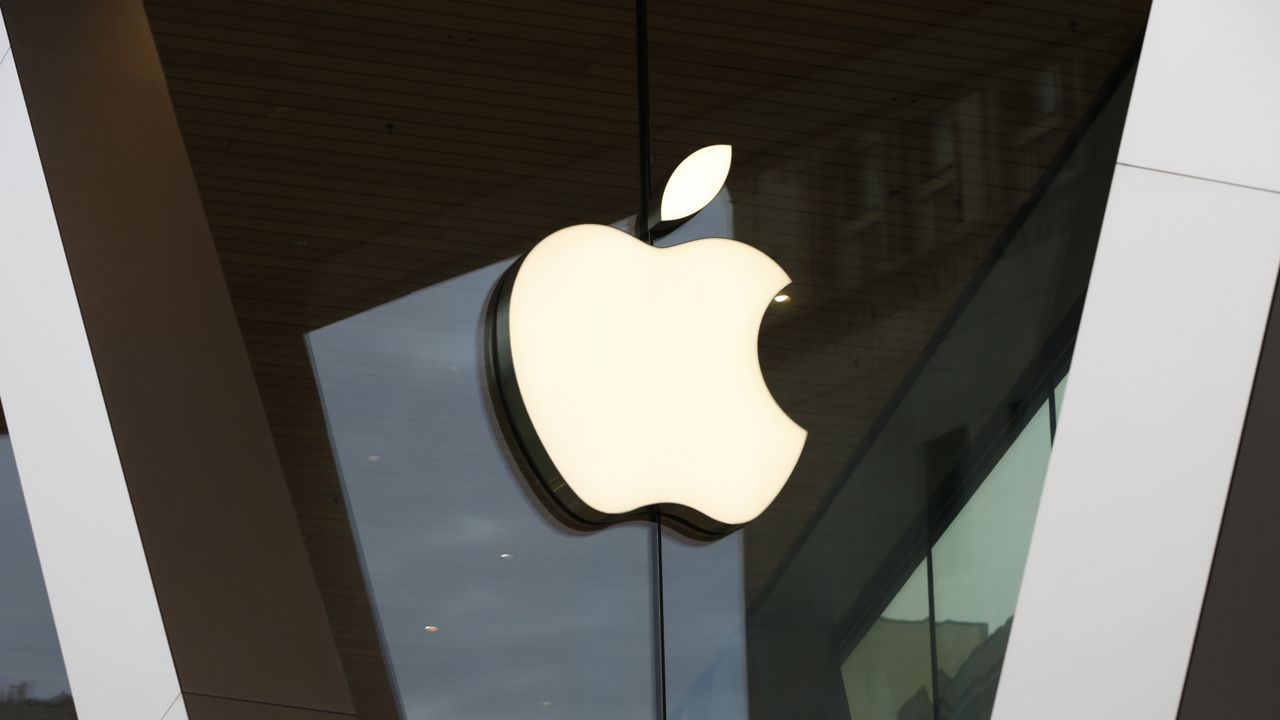 FILE - In this Saturday, March 14, 2020 file photo, an Apple logo adorns the facade of an Apple store in New York. (AP Photo/Kathy Willens, File)
