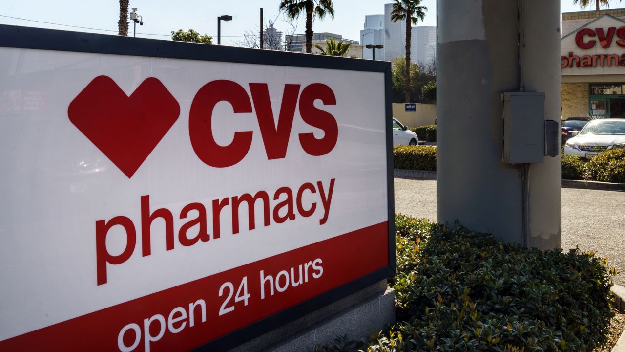 FILE: A CVS pharmacy is seen in Los Angeles Wednesday, Feb. 3, 2021. (AP Photo/Damian Dovarganes)