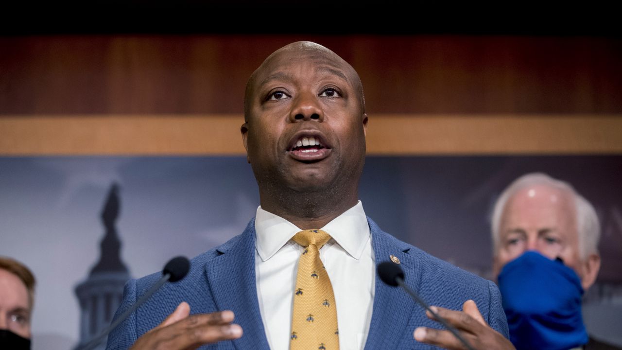 FILE - In this June 17, 2020, file photo, Sen. Tim Scott, R-S.C., accompanied by Republican senators speaks at a news conference on Capitol Hill in Washington. (AP Photo/Andrew Harnik, File)