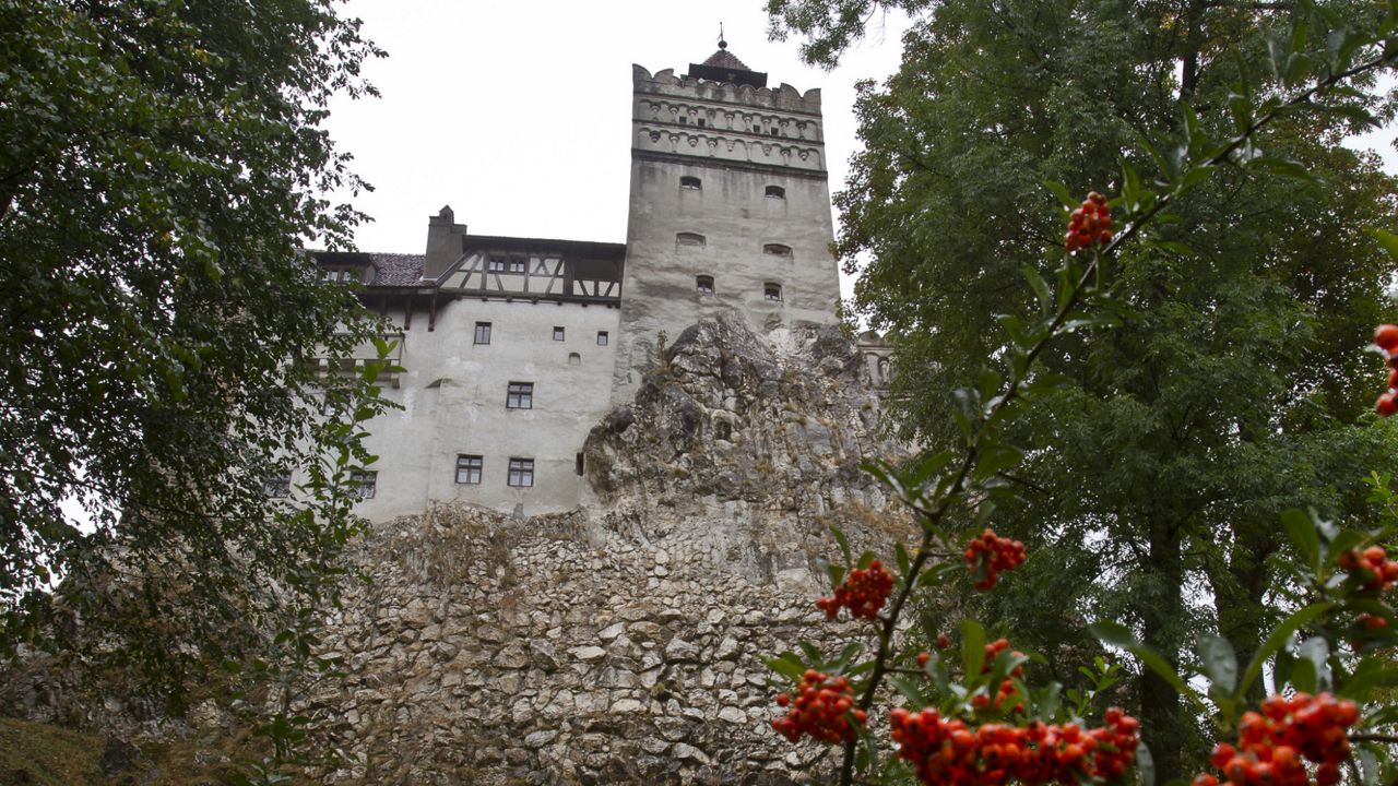 FILE - The Gothic Bran Castle, better known as Dracula Castle, is seen on a rainy day in Bran, in Romania's central Transylvania region. (AP Photo/Vadim Ghirda, File)