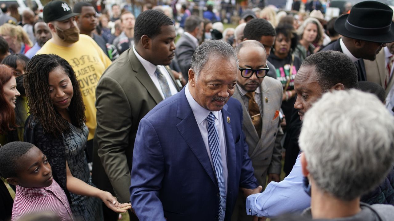 Rev. Jesse Jackson meets people after the dedication of a prayer wall  during the centennial of the Tulsa Race Massacre, Monday, May 31, 2021. (AP Photo/John Locher)