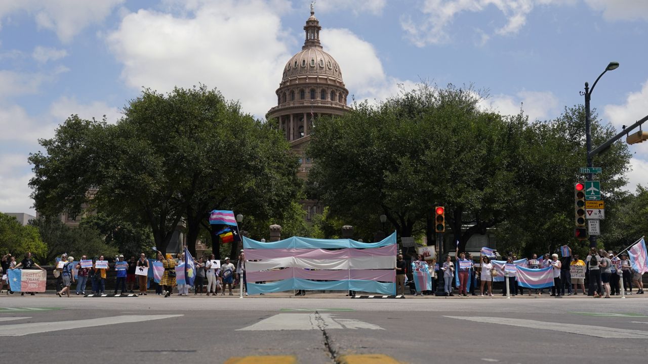 Demonstrators gather on the steps to the State Capitol to speak against transgender related legislation bills  Thursday, May 20, 2021, in Austin, Texas. (AP Photo/Eric Gay)