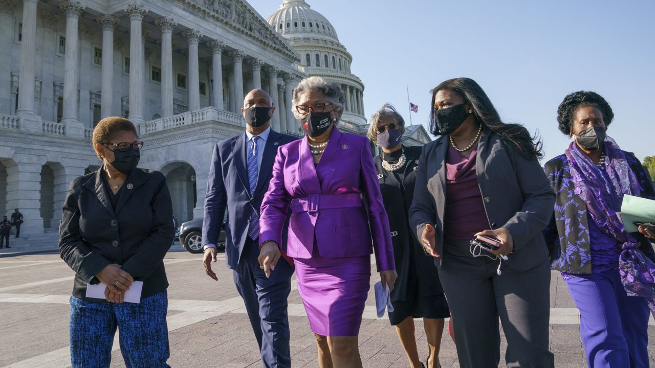 Members of the Congressional Black Caucus walk on Capitol Hill in Washington, Tuesday, April 20, 2021. From left are Rep. Karen Bass, D-Calif., Rep. Andre Carson, D-Ind. Rep. Joyce Beatty, D-Ohio, chair of the Congressional Black Caucus, Rep. Brenda Lawrence, D-Mich., Rep. Cori Bush, D-Mo., and Rep. Sheila Jackson Lee, D-Tex. (AP Photo/J. Scott Applewhite)