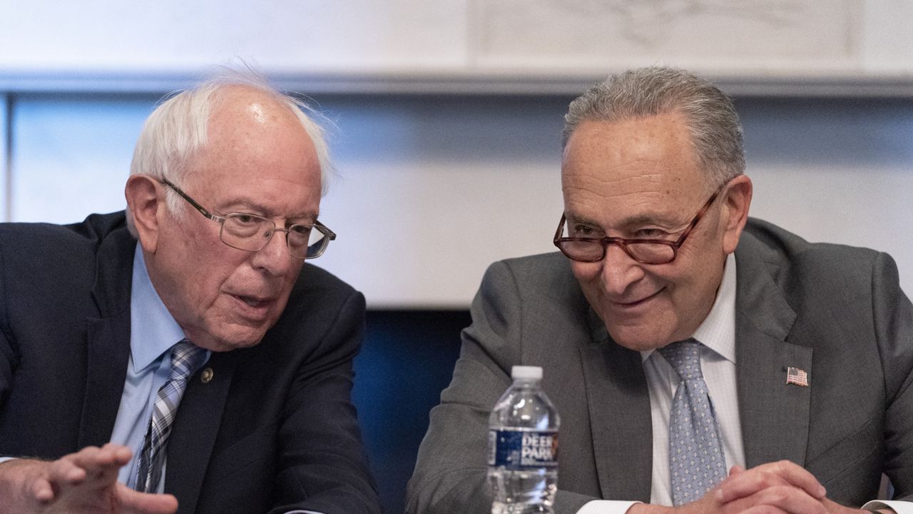Senate Majority Leader Chuck Schumer of N.Y., right, sits next to Sen. Bernie Sanders, I-Vt., Wednesday, June 16, 2021, on Capitol Hill in Washington. (AP Photo/Jacquelyn Martin)