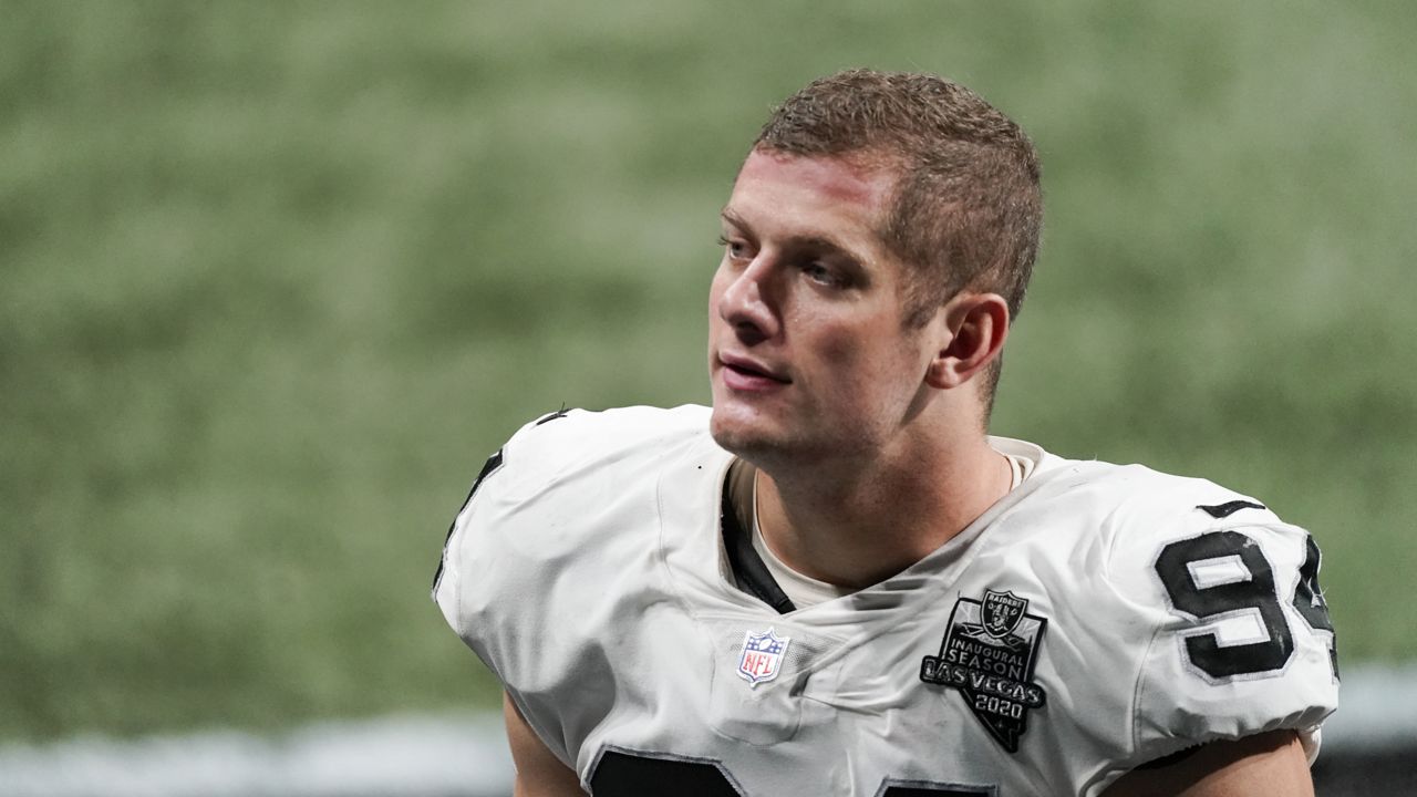 Las Vegas Raiders defensive end Carl Nassib (94) leaves the field after an NFL football game against the Atlanta Falcons, Sunday, Nov. 29, 2020, in Atlanta. (AP Photo/John Bazemore)