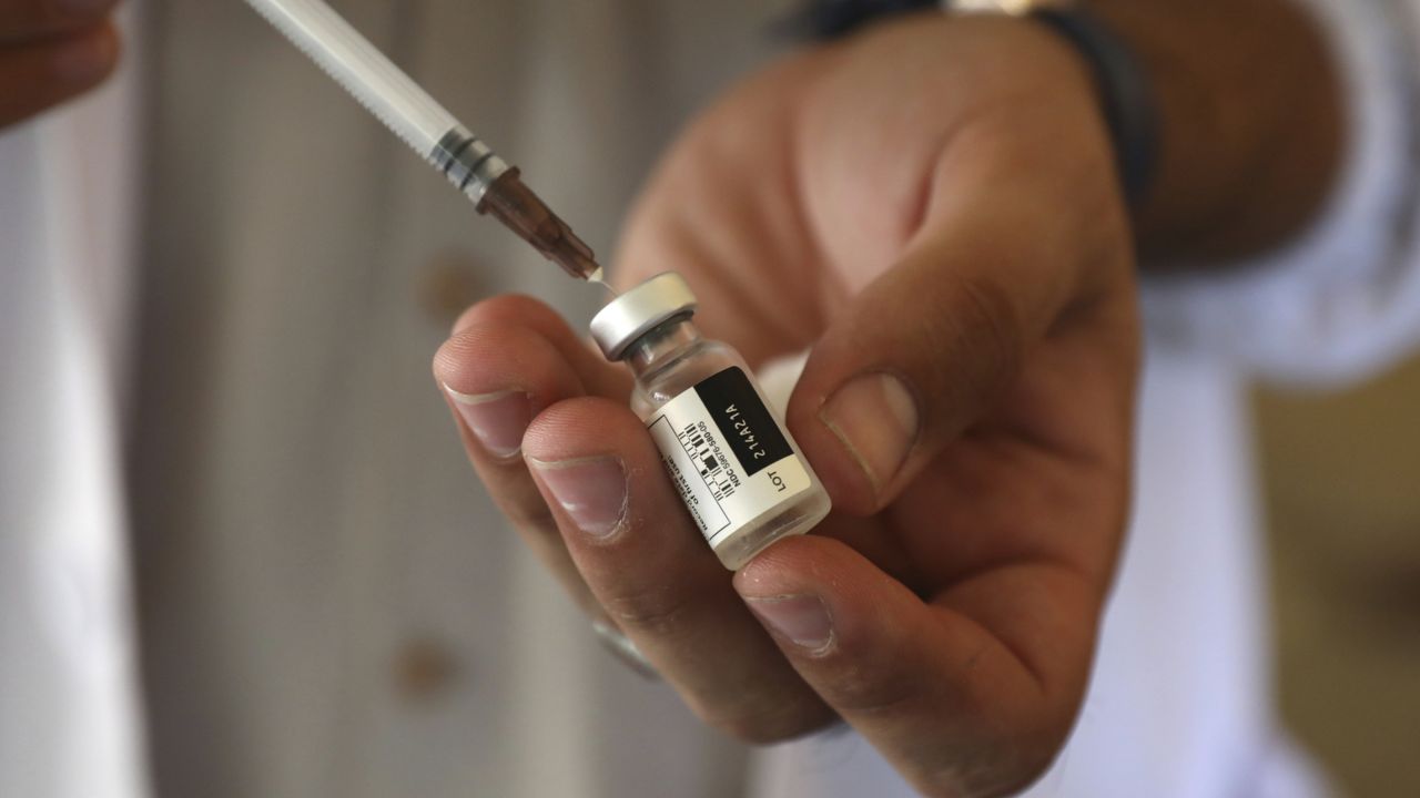 FILE - In this Sunday, July 11, 2021 file photo, a doctor fills a syringe with the Johnson & Johnson COVID-19 vaccine at a vaccination center in Kabul, Afghanistan. (AP Photo/Rahmat Gul, file)