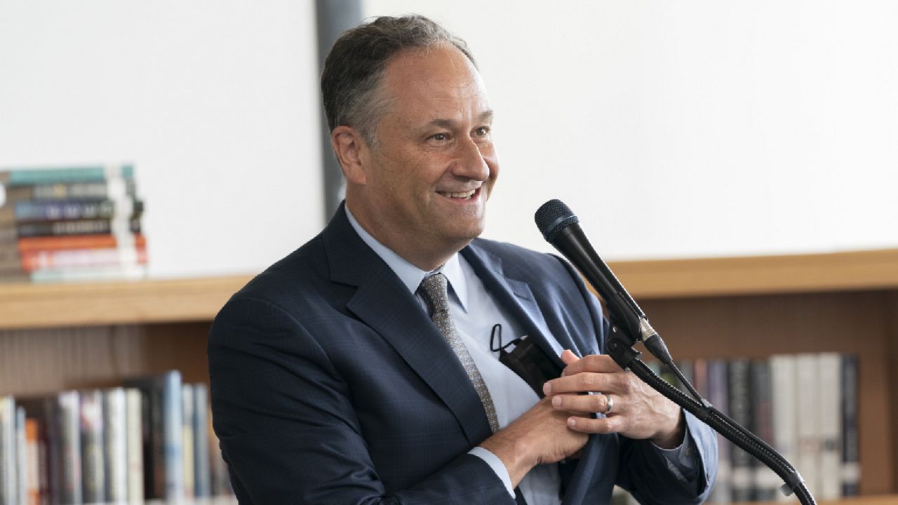 FILE: Douglas Emhoff, husband of Vice President Kamala Harris, puts away his face mask while speaking to District of Columbia COVID-19 vaccine ambassadors, Thursday, July 8, 2021. (AP Photo/Jacquelyn Martin)