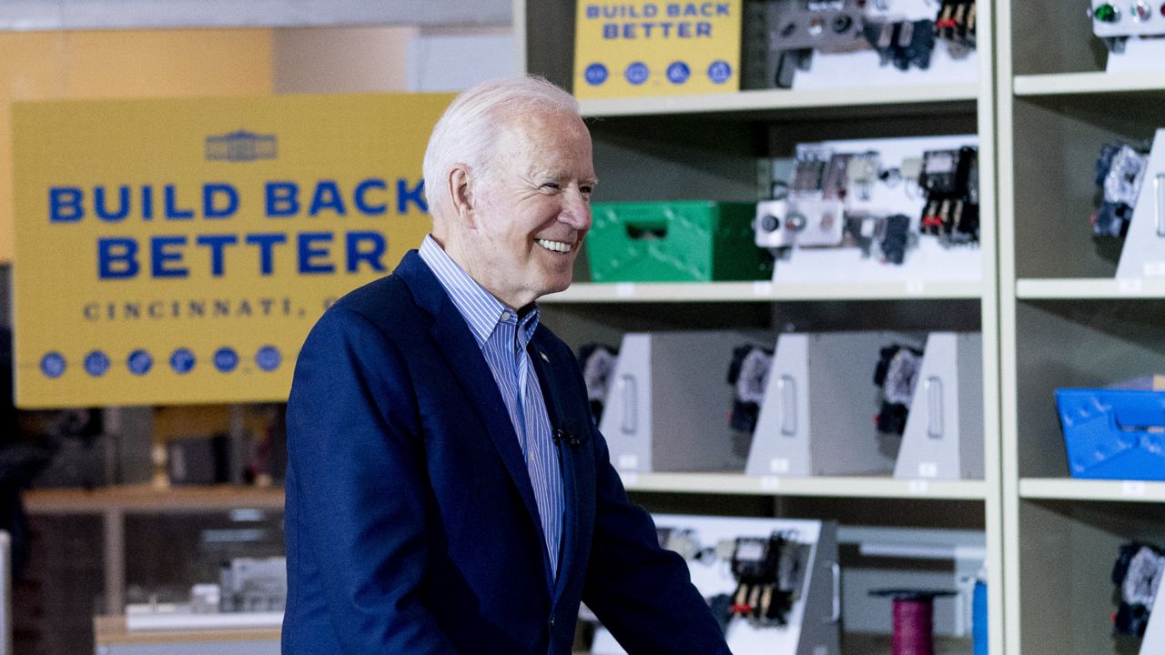 President Joe Biden smiles while meeting with an instructor and apprentice at the IBEW / NECA Electrical Training Center in Cincinnati, Wednesday, July 21, 2021. (AP Photo/Andrew Harnik)