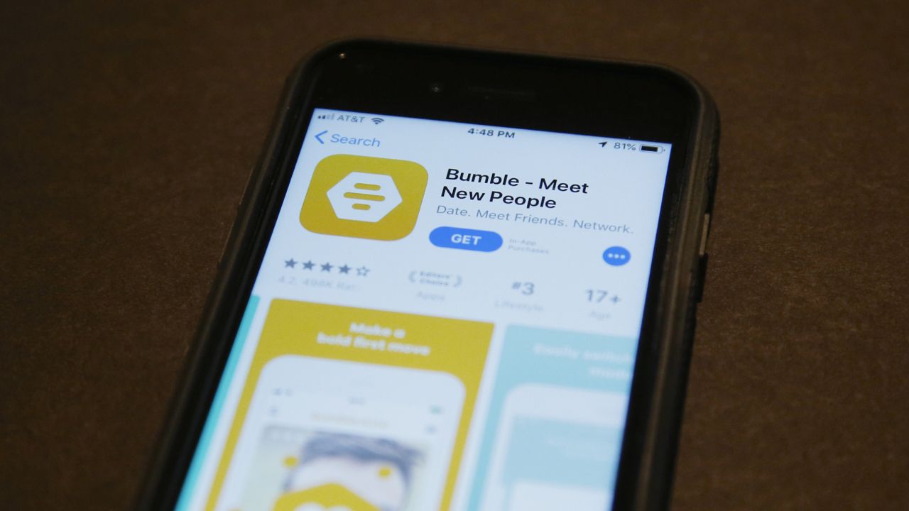 FILE: A phone with an App Store selection of the dating app Bumble is pictured Thursday, Aug. 29, 2019, in Oklahoma City. (AP Photo/Sue Ogrocki)