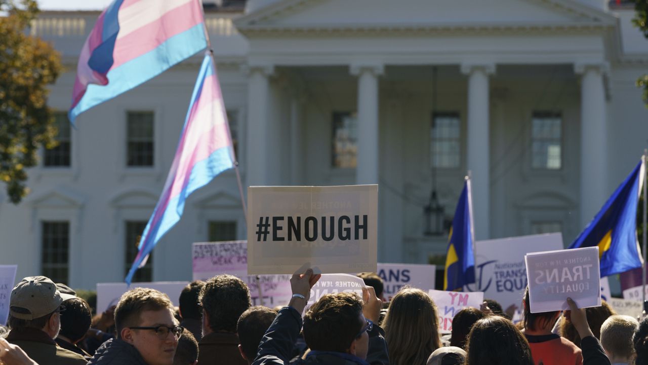 FILE: The National Center for Transgender Equality, NCTE, and the Human Rights Campaign gather on Pennsylvania Avenue in front of the White House in Washington, Monday, Oct. 22, 2018, for a #WontBeErased rally. (AP Photo/Carolyn Kaster)