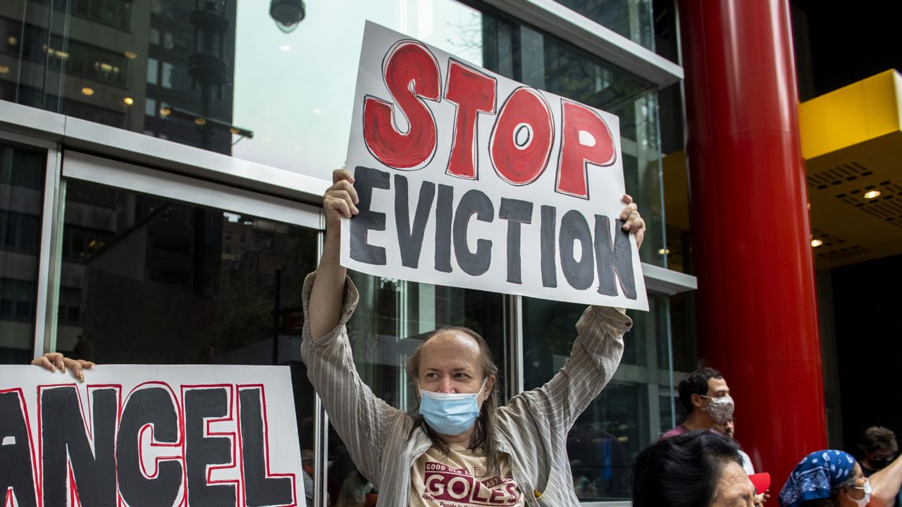 FILE - In this Aug. 4, 2021, file photo, housing advocates protest in New York. (AP Photo/Brittainy Newman, File)