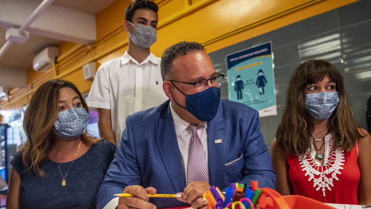 Education Secretary Miguel Cardona visits P.S. 5 Port Morris, a Bronx elementary school, Tuesday, Aug. 17, 2021 in New York. (AP Photo/Brittainy Newman)