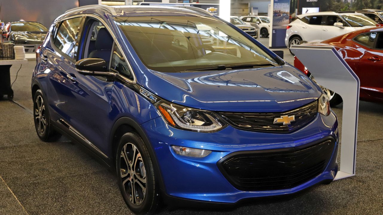 FILE - In this Feb. 13, 2020 file photo a 2020 Chevrolet Bolt EV is displayed at the 2020 Pittsburgh International Auto Show. (AP Photo/Gene J. Puskar, File)