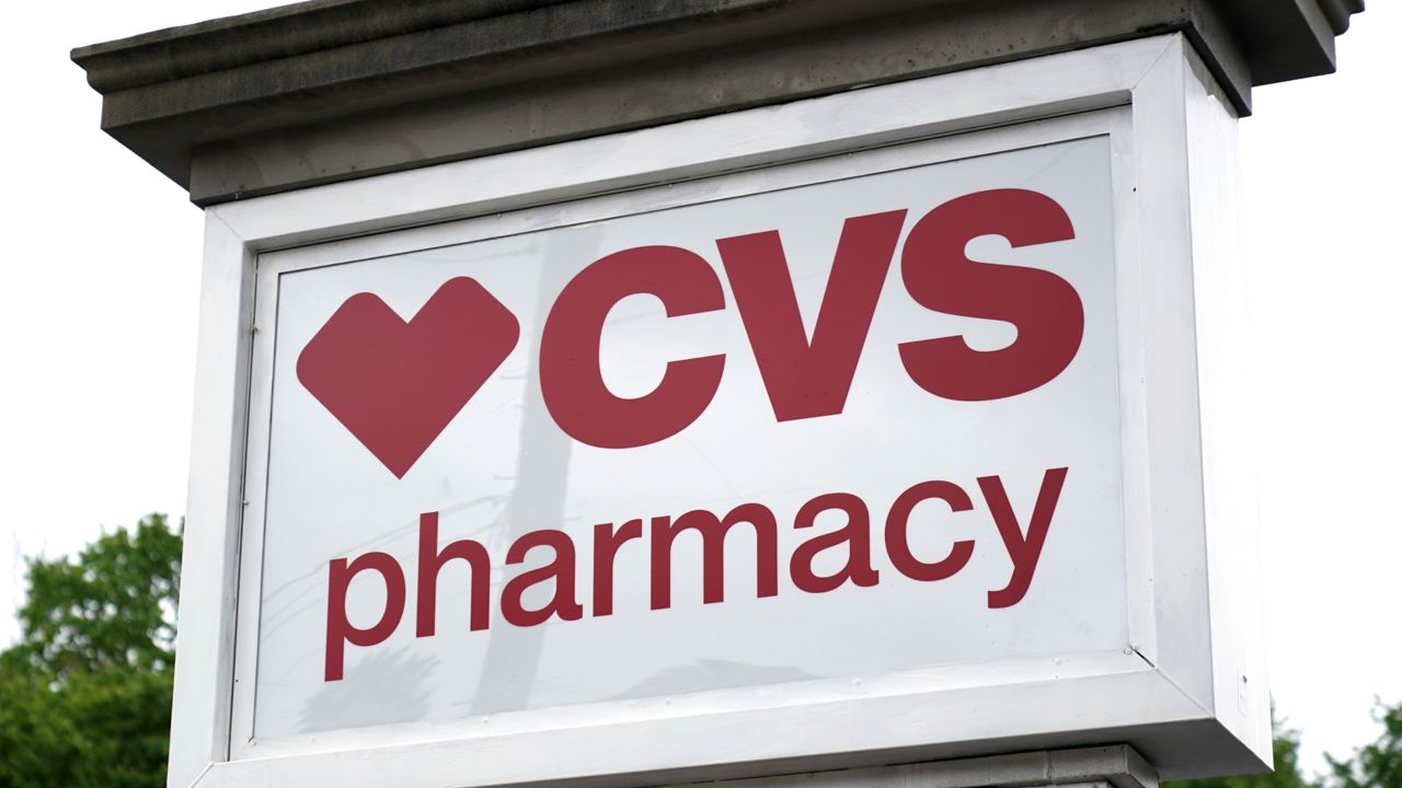 FILE: This May 3, 2021 photo shows a CVS Pharmacy in Mount Lebanon, Pa. (AP Photo/Gene J. Puskar)